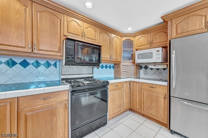 Interior, Kitchen, Recessed Lighting, Tile Countertops