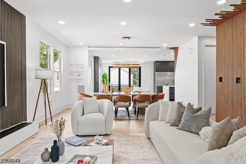Chandelier, Dining room, Interior, Kitchen, Living room, Pendant Lights, Recessed Lighting, Stainless Steel Appliances, Wood Texture Flooring