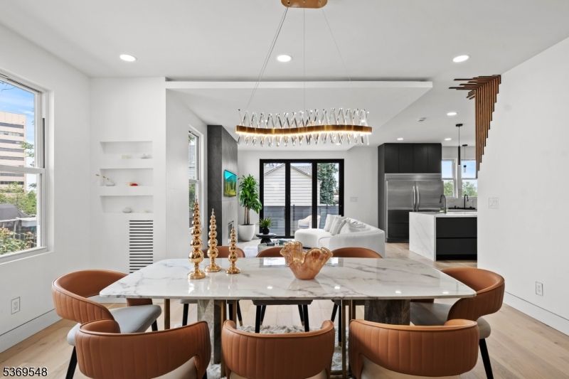 Chandelier, Dining room, Interior, Kitchen, Pendant Lights, Recessed Lighting, Stainless Steel Appliances, Wood Texture Flooring