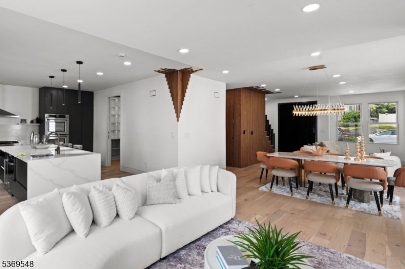 Dining room, Interior, Kitchen, Living room, Pendant Lights, Recessed Lighting, Stainless Steel Appliances, Wood Texture Flooring