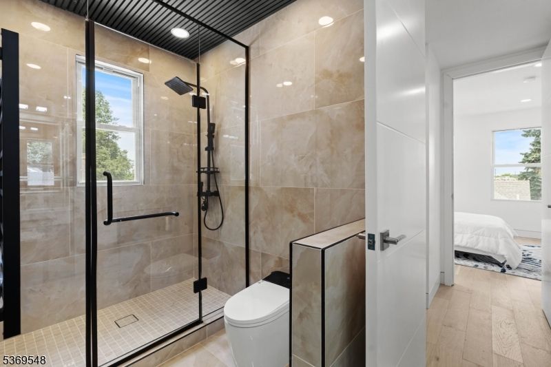 Bathroom, Bedroom, Glass Shower, Interior, Recessed Lighting, Wood Texture Flooring