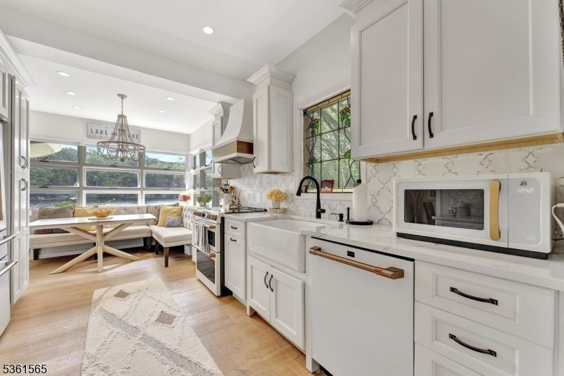 Chandelier, Dining room, Interior, Kitchen, Recessed Lighting, Stainless Steel Appliances, Wood Texture Flooring