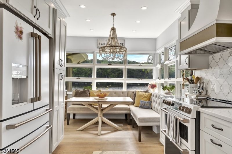Chandelier, Dining room, Interior, Kitchen, Recessed Lighting, Stainless Steel Appliances, Wood Texture Flooring