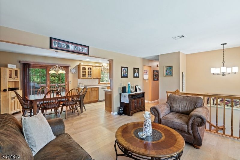 Chandelier, Dining room, Interior, Kitchen, Living room, Pendant Lights, Recessed Lighting, Wood Texture Flooring