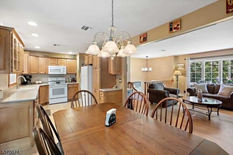 Chandelier, Dining room, Interior, Kitchen, Living room, Pendant Lights, Recessed Lighting, Wood Texture Flooring