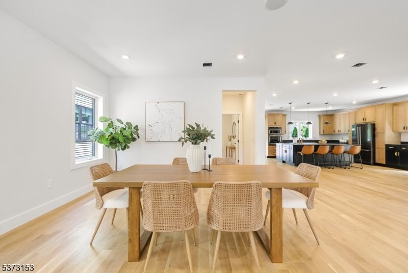 Dining room, Interior, Kitchen, Pendant Lights, Recessed Lighting, Stainless Steel Appliances, Wood Texture Flooring