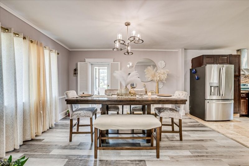 Chandelier, Dining room, Interior, Kitchen, Pendant Lights, Stainless Steel Appliances, Wood Texture Flooring