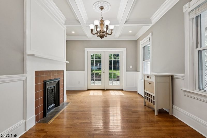 Chandelier, Empty room, Fireplace, Interior, Recessed Lighting, Wood Texture Flooring
