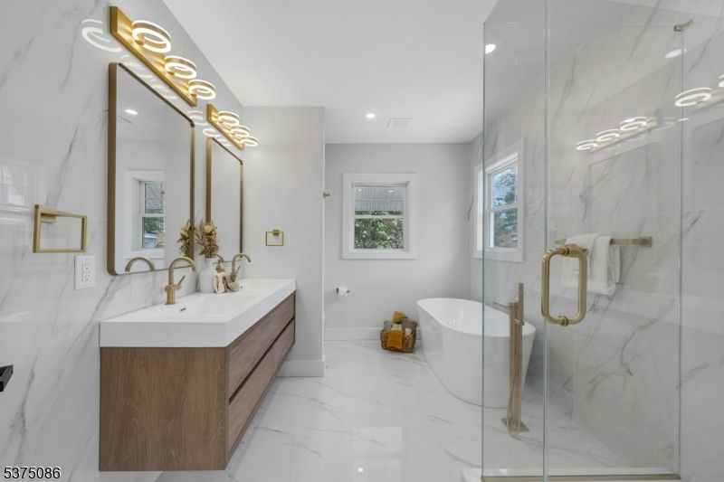 Bathroom, Dual Sink Vanities, Free Standing Baths, Glass Shower, Interior, Marble, Marble Walls, Recessed Lighting