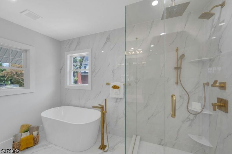Bathroom, Free Standing Baths, Glass Shower, Interior, Marble, Marble Walls, Recessed Lighting