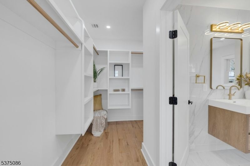 Bathroom, Interior, Marble, Recessed Lighting, Walk-in Closets, Wood Texture Flooring