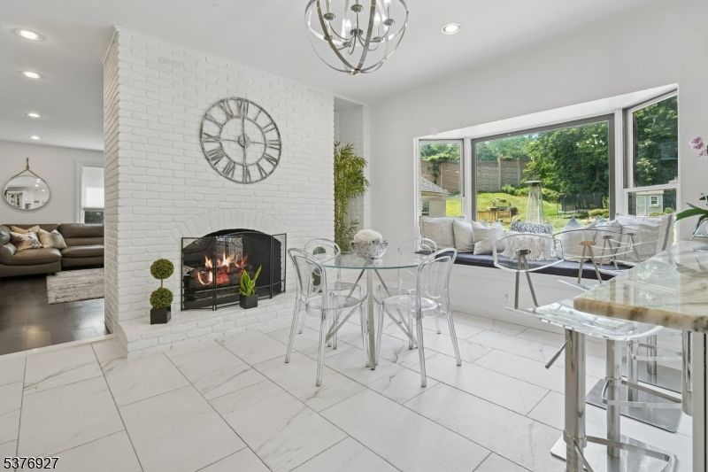 Dining room, Fireplace, Interior, Living room, Marble, Pendant Lights, Recessed Lighting, Stone Walls