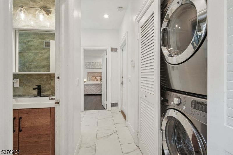 Bedroom, Interior, Marble, Recessed Lighting, Utility Closets, Washer, Wood Texture Flooring
