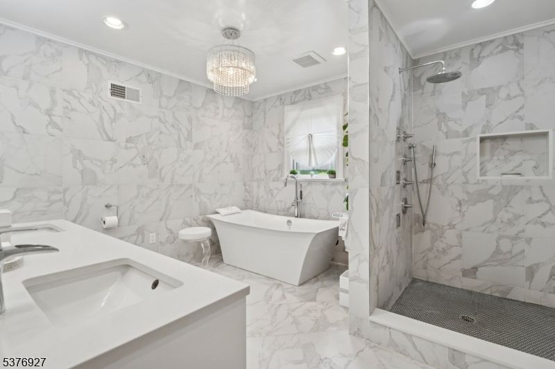 Bathroom, Chandelier, Dual Sink Vanities, Free Standing Baths, Interior, Marble, Marble Walls, Recessed Lighting
