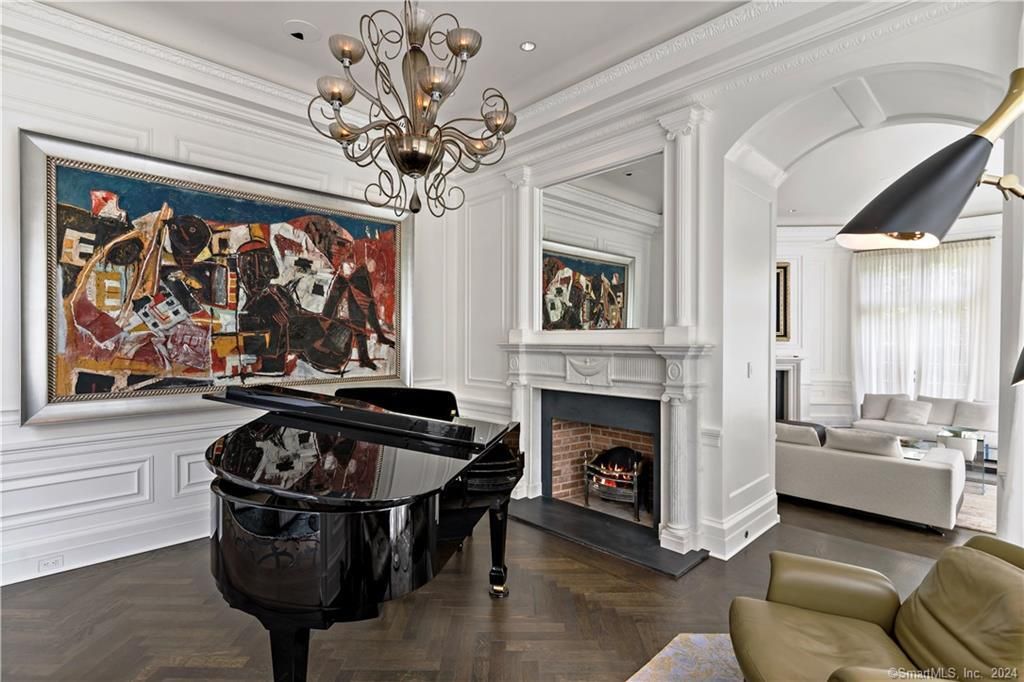 Chandelier, Fireplace, Interior, Living room, Piano, Recessed Lighting, Wood Texture Flooring