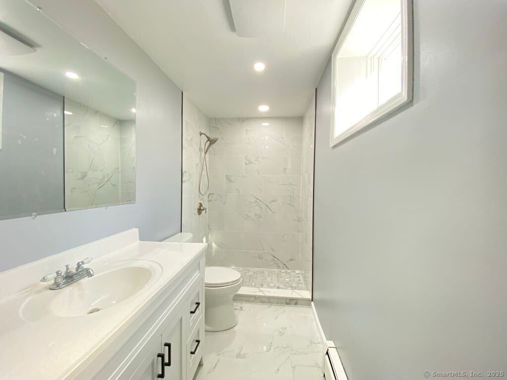 Bathroom, Dual Sink Vanities, Glass Shower, Interior, Marble, Marble Walls, Recessed Lighting