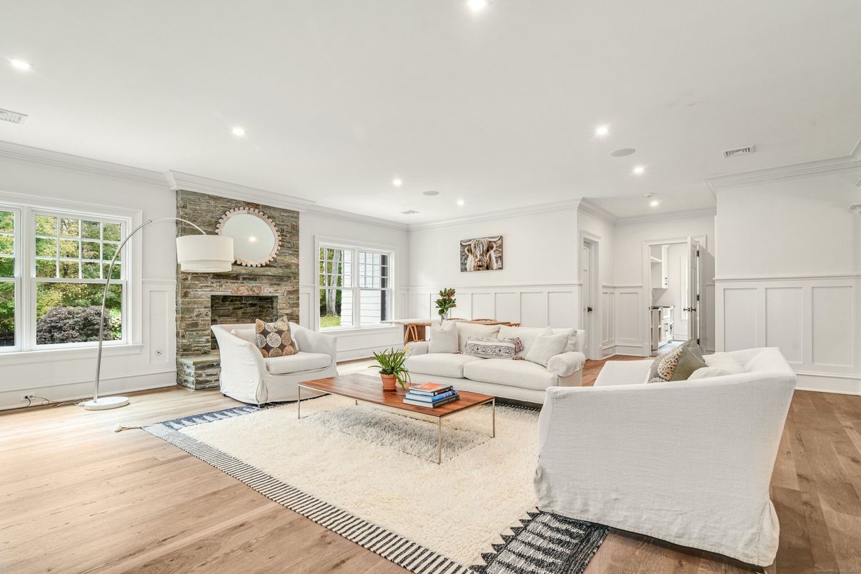 Fireplace, Interior, Living room, Recessed Lighting, Stone Walls, Wood Texture Flooring