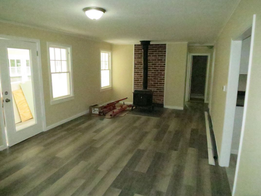 Empty room, Fireplace, Interior, Stone Walls, Wood Texture Flooring