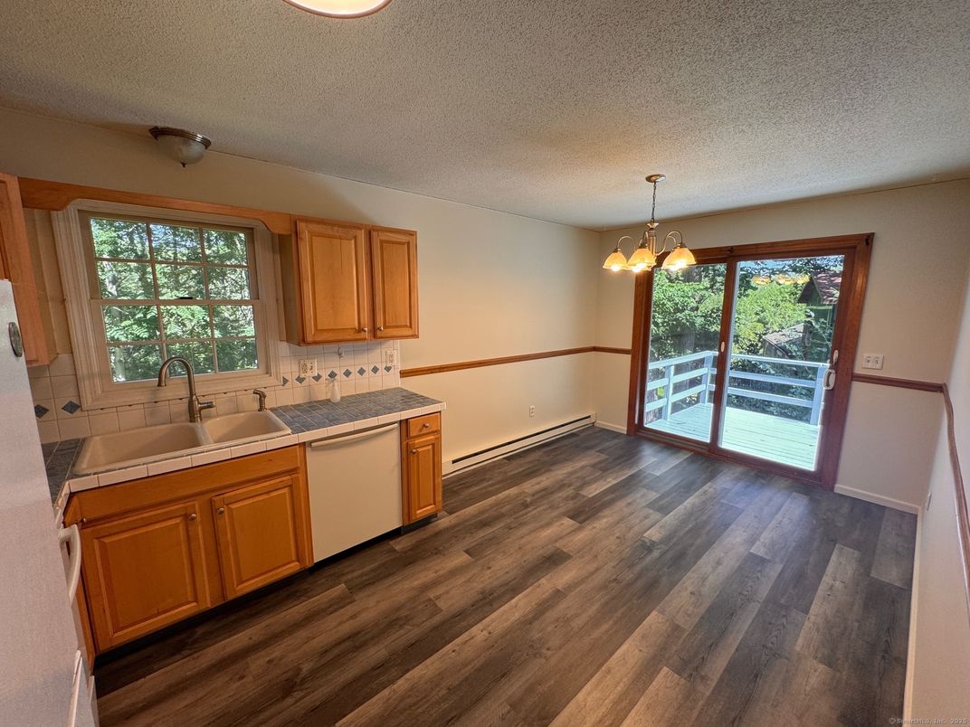Interior, Kitchen, Pendant Lights, Tile Countertops, Wood Texture Flooring