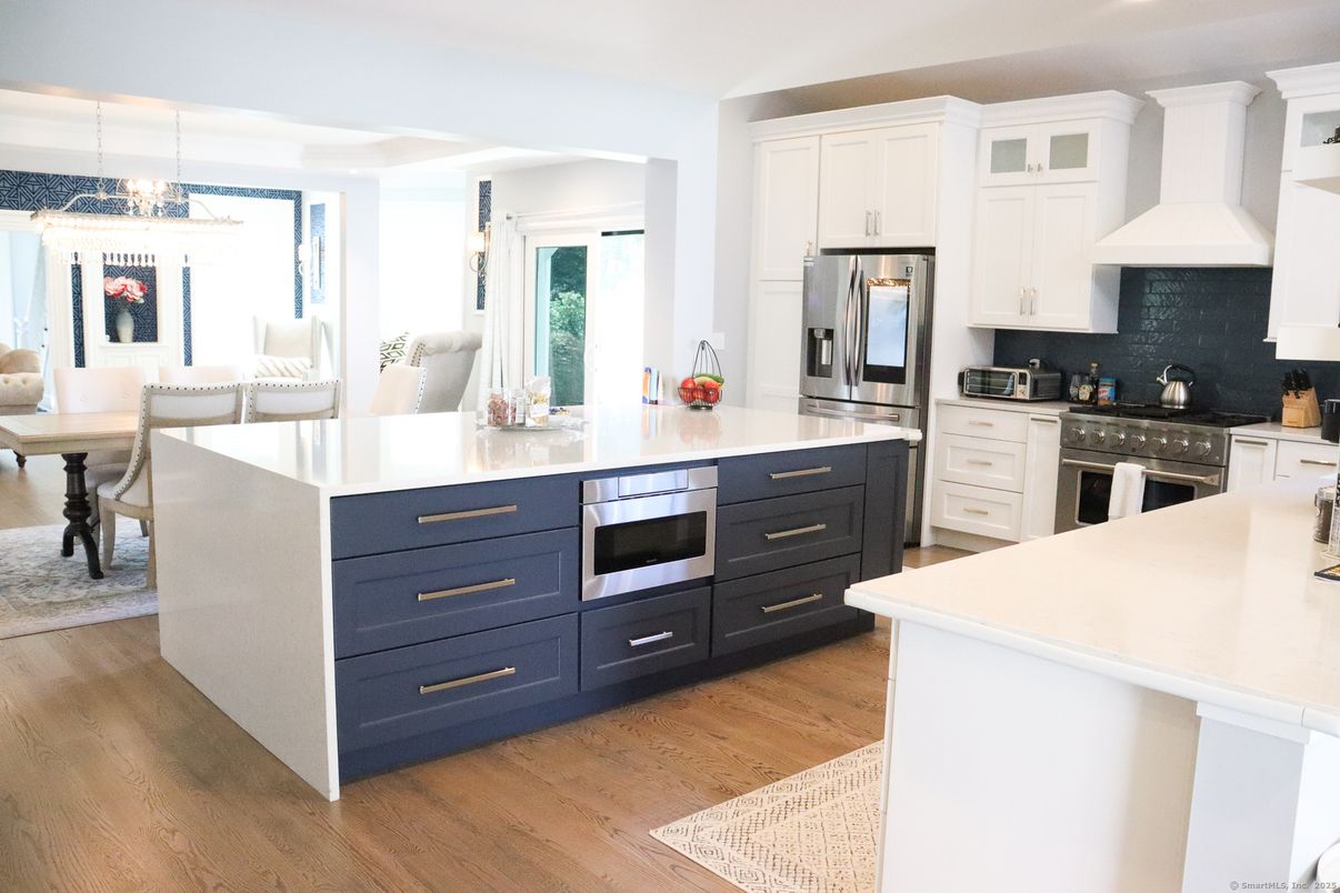 Dining room, Interior, Kitchen, Pendant Lights, Recessed Lighting, Stainless Steel Appliances, Wood Texture Flooring