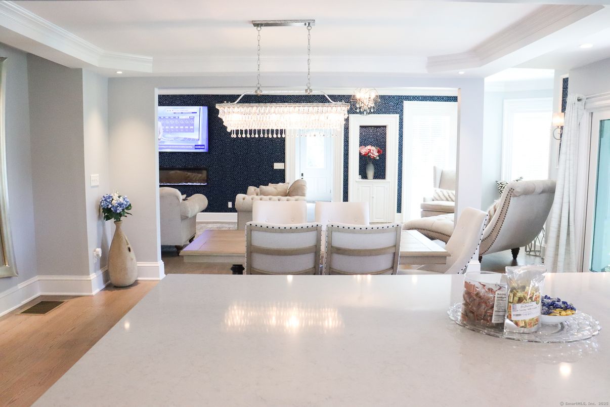 Chandelier, Dining room, Fireplace, Interior, Living room, Recessed Lighting, Wood Texture Flooring