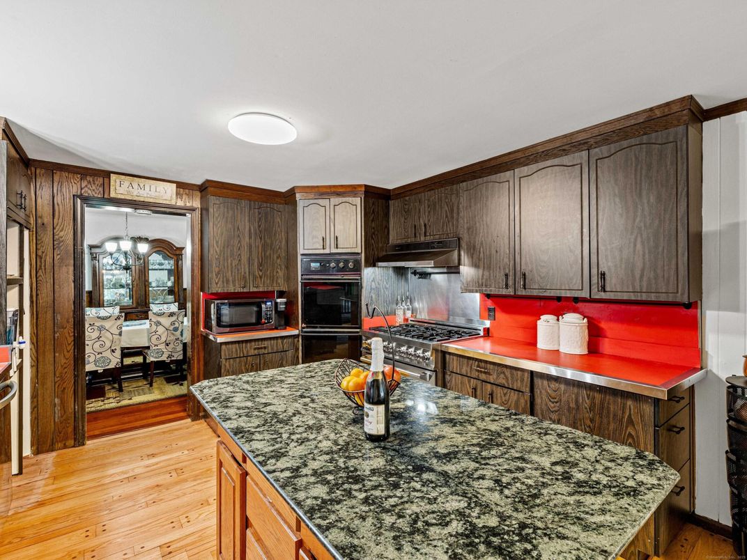 Chandelier, Dining room, Interior, Kitchen, Stainless Steel Appliances, Wood Texture Flooring
