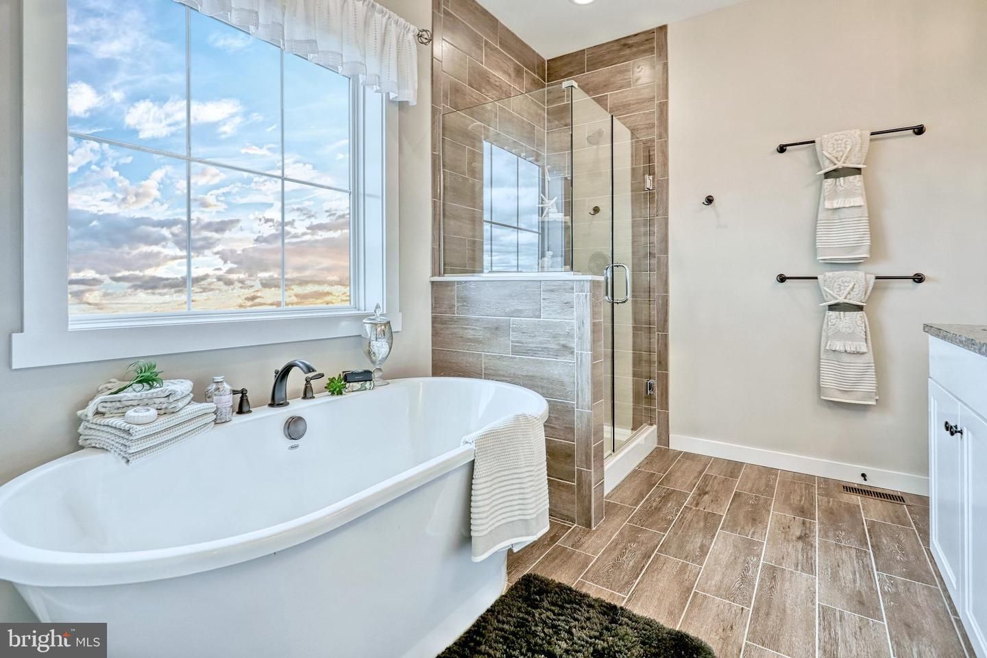 Bathroom, Free Standing Baths, Glass Shower, Interior, Recessed Lighting, Wood Texture Flooring