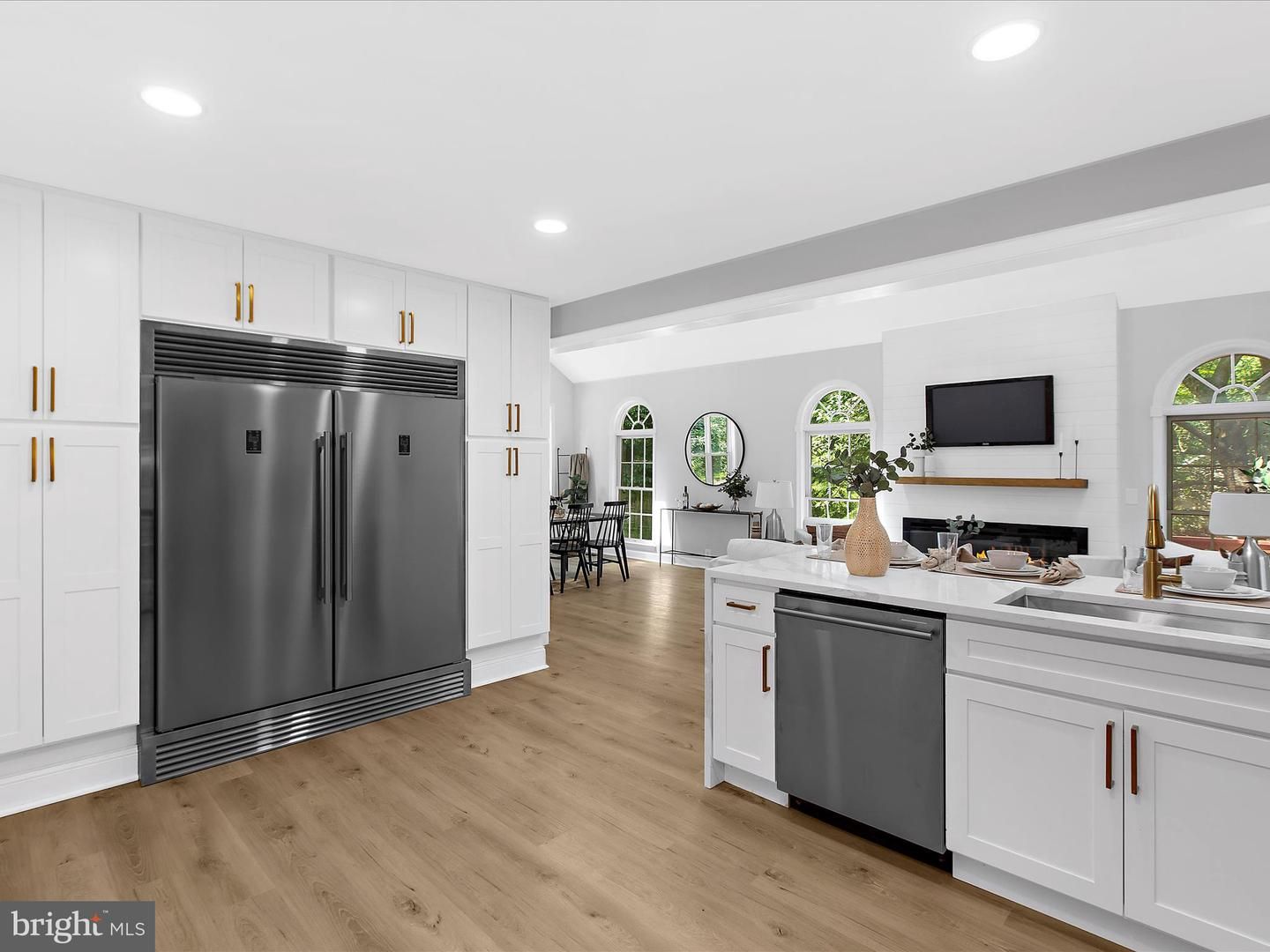 Dining room, Fireplace, Interior, Kitchen, Recessed Lighting, Stainless Steel Appliances, Wood Texture Flooring