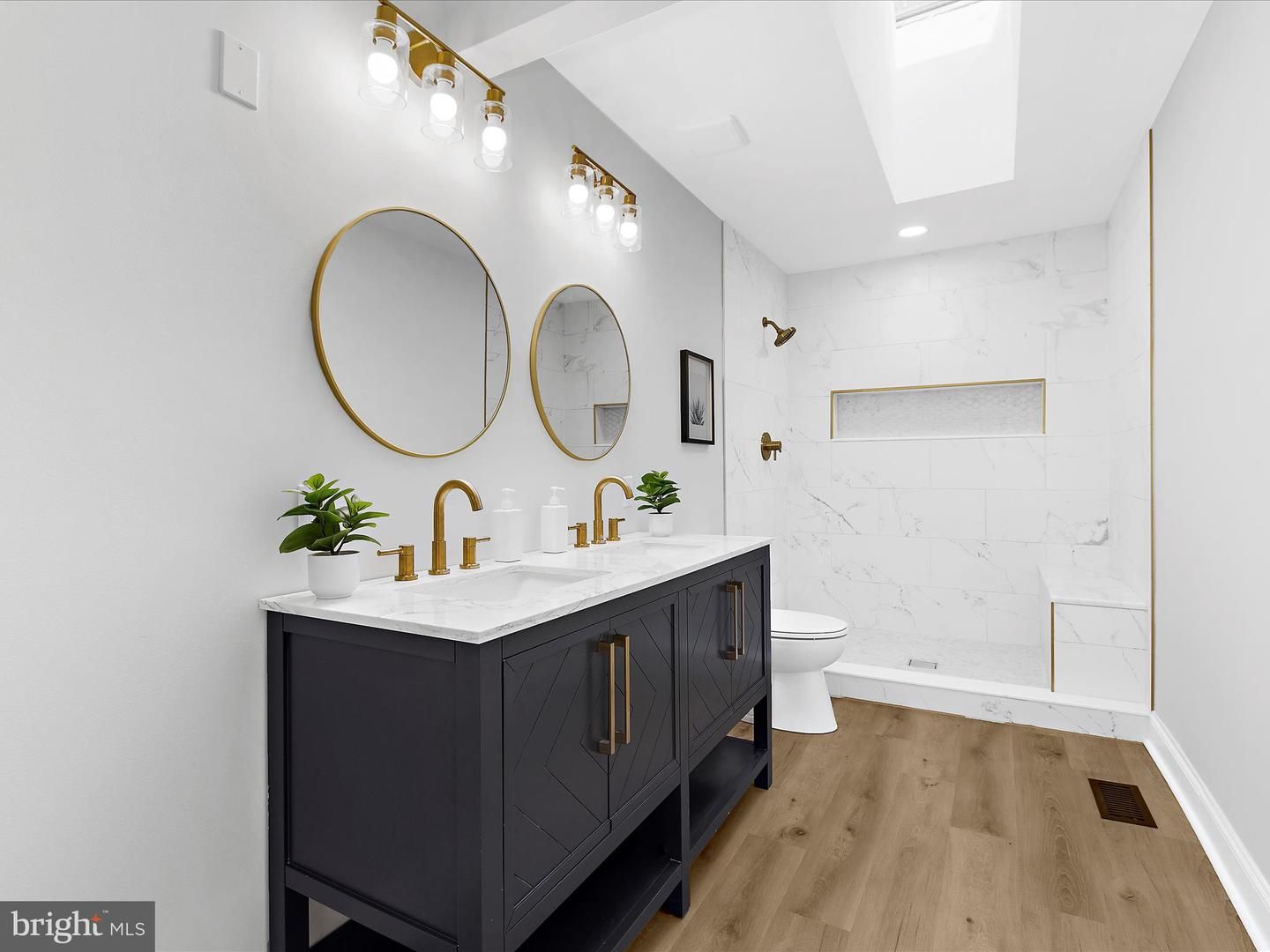 Bathroom, Dual Sink Vanities, Interior, Marble Walls, Recessed Lighting, Wood Texture Flooring