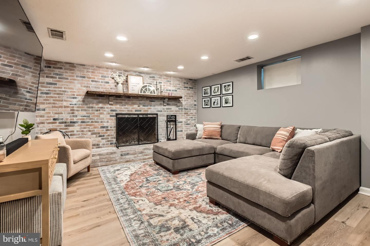 Fireplace, Interior, Living room, Recessed Lighting, Stone Walls, Wood Texture Flooring