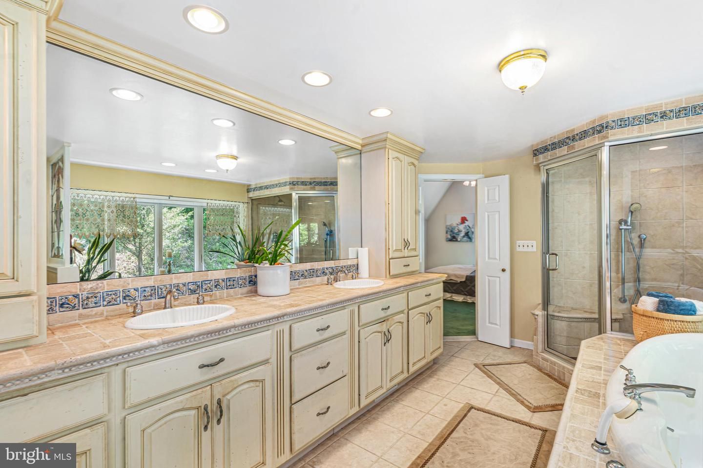 Bathroom, Dual Sink Vanities, Glass Shower, Interior, Recessed Lighting, Tile Countertops