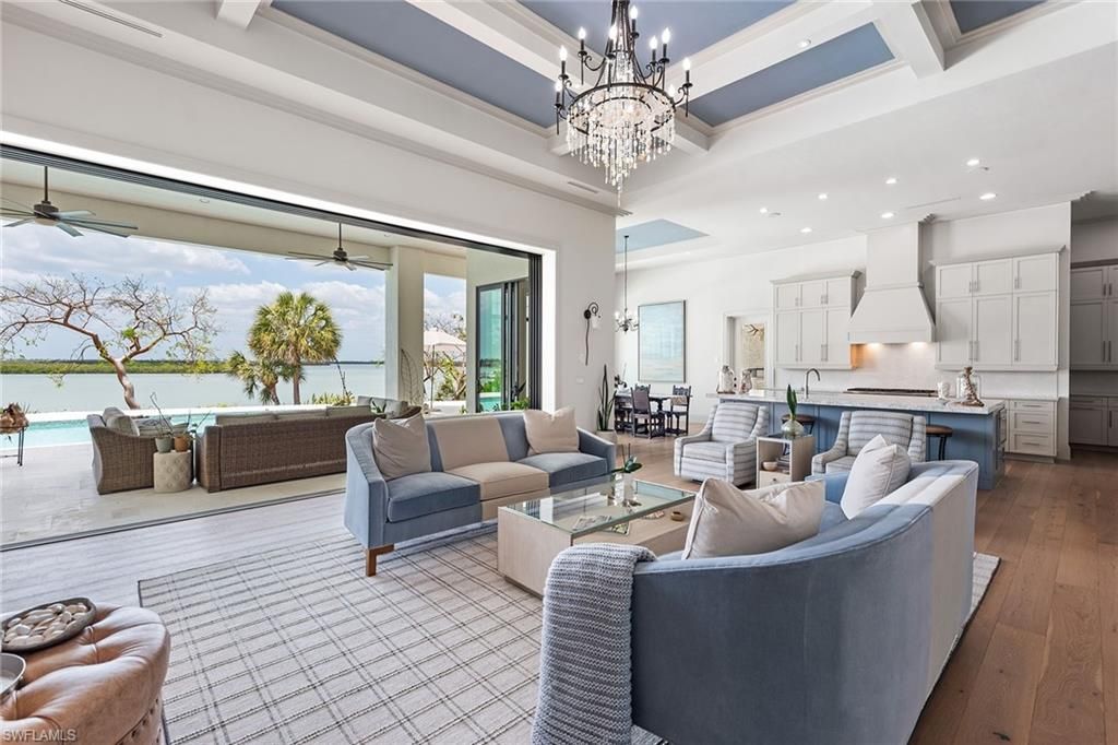 Chandelier, Dining room, Interior, Kitchen, Living room, Recessed Lighting, Water, Wood Texture Flooring