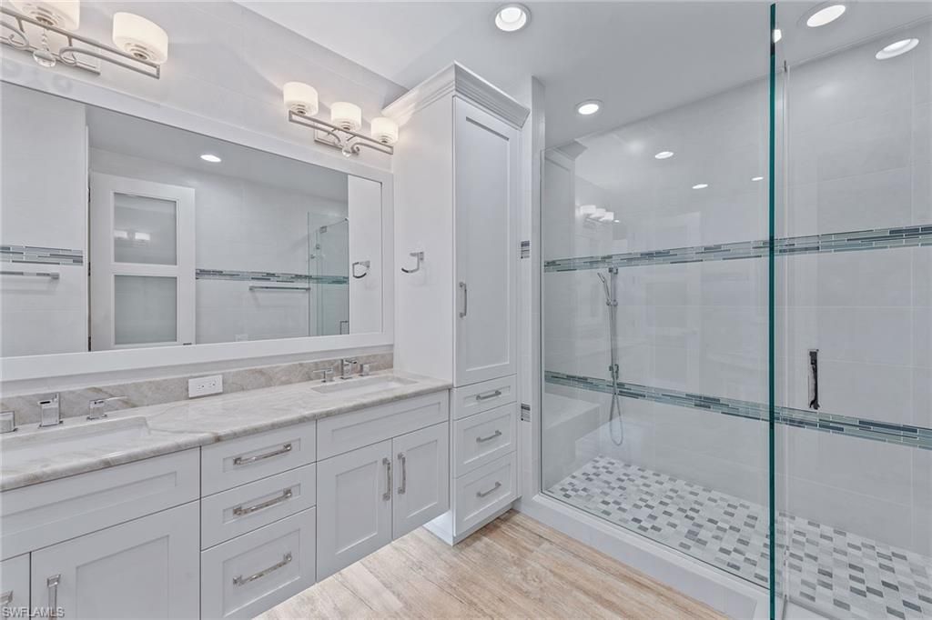 Bathroom, Dual Sink Vanities, Glass Shower, Interior, Recessed Lighting, Wood Texture Flooring