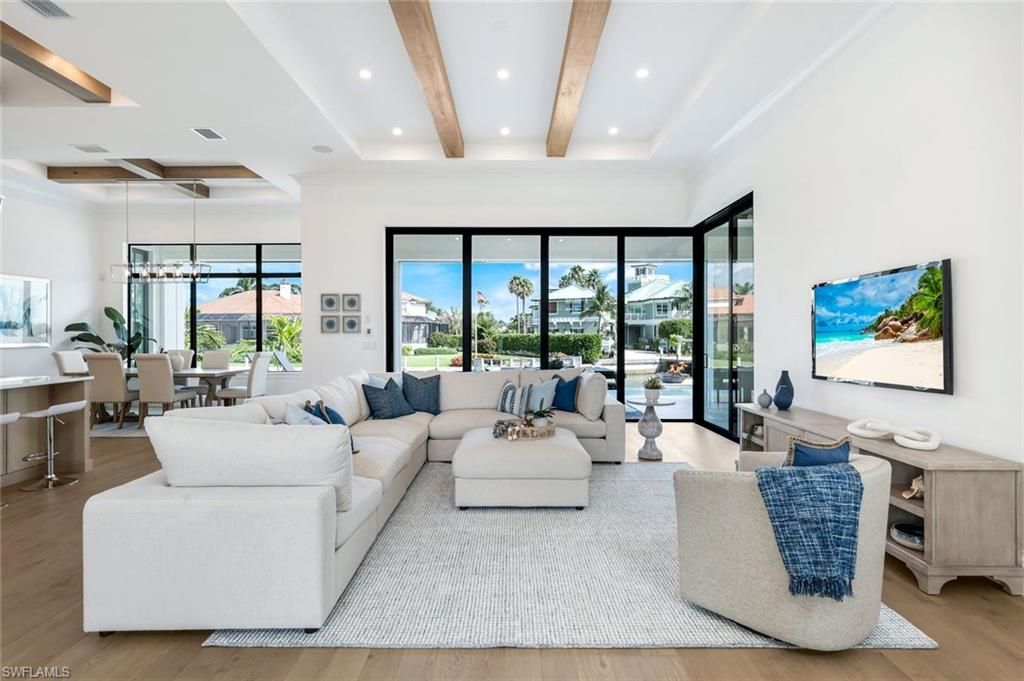 Dining room, Interior, Living room, Pendant Lights, Recessed Lighting, Water, Wooden Beams, Wood Texture Flooring