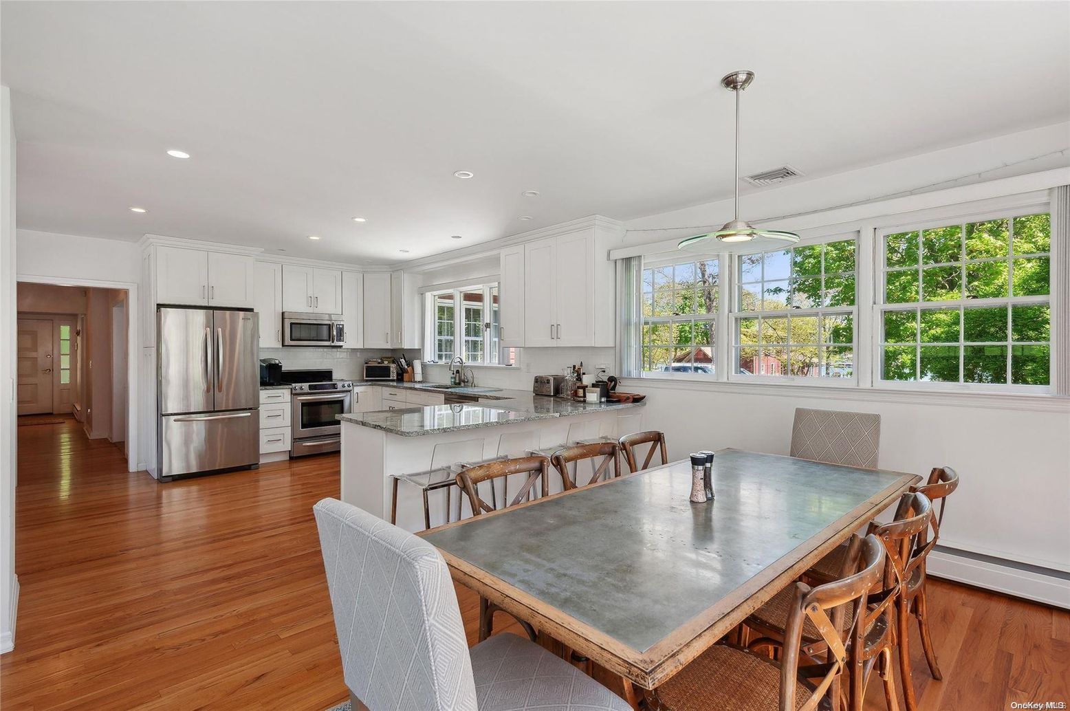 Dining room, Interior, Kitchen, Pendant Lights, Recessed Lighting, Stainless Steel Appliances, Wood Texture Flooring