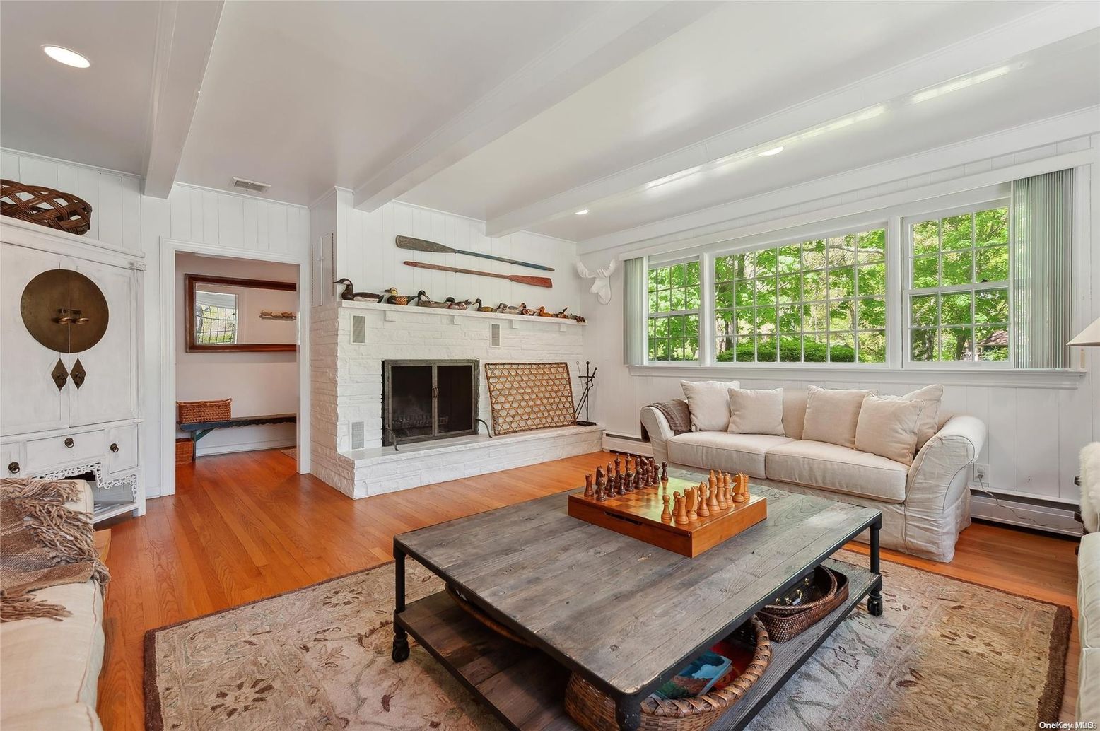 Fireplace, Interior, Living room, Recessed Lighting, Stone Walls, Wood Texture Flooring