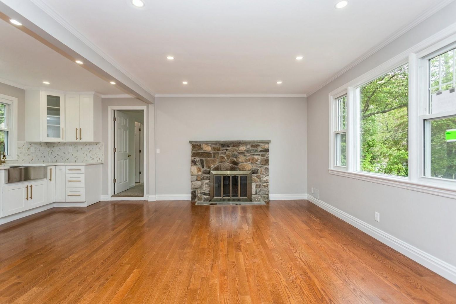 Empty room, Fireplace, Interior, Kitchen, Recessed Lighting, Wood Texture Flooring