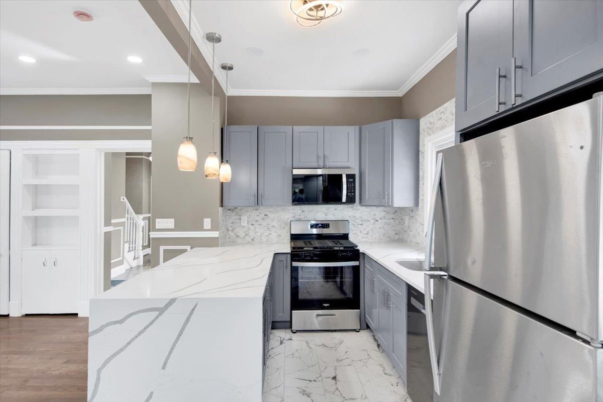 Interior, Kitchen, Marble, Pendant Lights, Recessed Lighting, Stainless Steel Appliances, Wood Texture Flooring