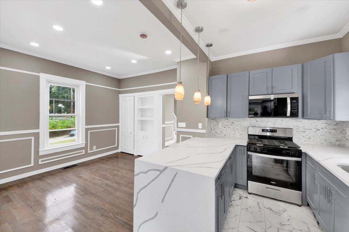 Interior, Kitchen, Marble, Pendant Lights, Recessed Lighting, Stainless Steel Appliances, Wood Texture Flooring