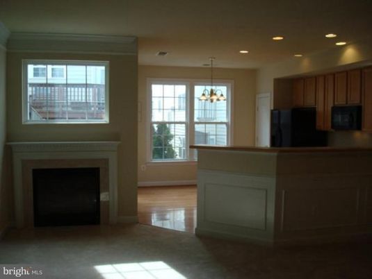 Chandelier, Empty room, Fireplace, Interior, Kitchen, Pendant Lights, Recessed Lighting, Wood Texture Flooring