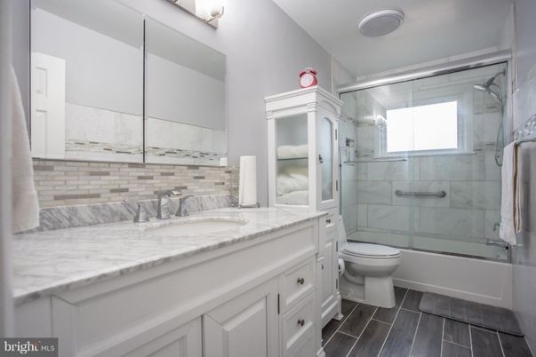 Bathroom, Glass Shower, Interior, Marble Walls, Wood Texture Flooring