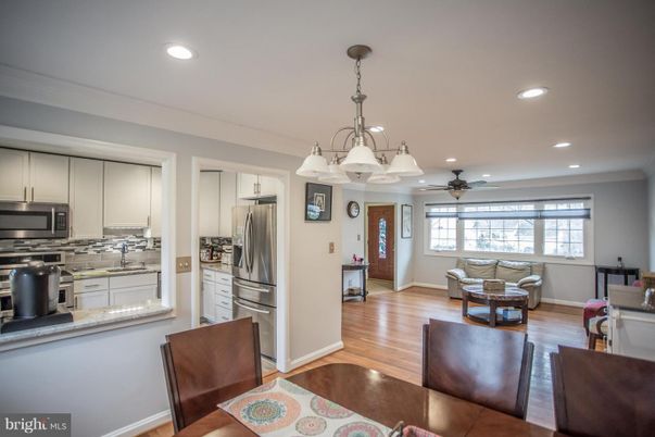 Chandelier, Interior, Kitchen, Living room, Recessed Lighting, Stainless Steel Appliances, Wood Texture Flooring