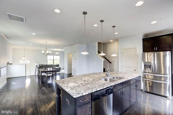 Chandelier, Dining room, Interior, Kitchen, Pendant Lights, Recessed Lighting, Stainless Steel Appliances, Wood Texture Flooring