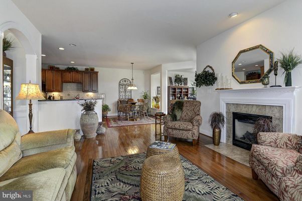 Chandelier, Dining room, Fireplace, Interior, Kitchen, Living room, Pendant Lights, Recessed Lighting, Wood Texture Flooring