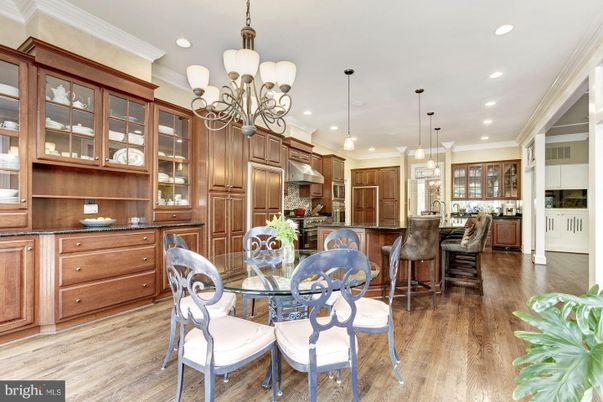 Chandelier, Dining room, Interior, Kitchen, Pendant Lights, Recessed Lighting, Stainless Steel Appliances, Wood Texture Flooring