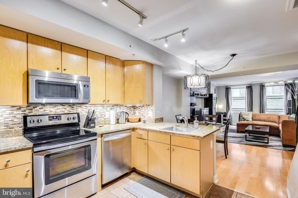 Chandelier, Dining room, Interior, Kitchen, Living room, Recessed Lighting, Stainless Steel Appliances, Wood Texture Flooring