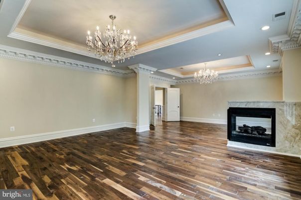 Chandelier, Empty room, Fireplace, Interior, Recessed Lighting, Wood Texture Flooring