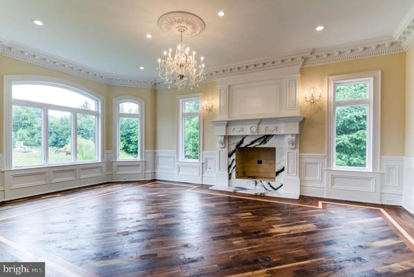 Chandelier, Empty room, Fireplace, Interior, Recessed Lighting, Wood Texture Flooring