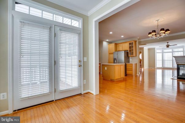 Chandelier, Empty room, Fireplace, Interior, Kitchen, Recessed Lighting, Wood Texture Flooring