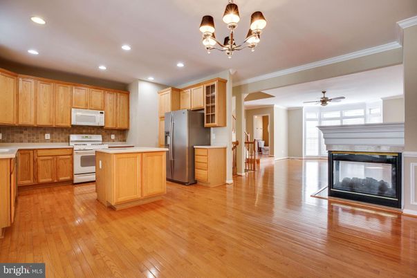 Chandelier, Fireplace, Interior, Kitchen, Recessed Lighting, Wood Texture Flooring